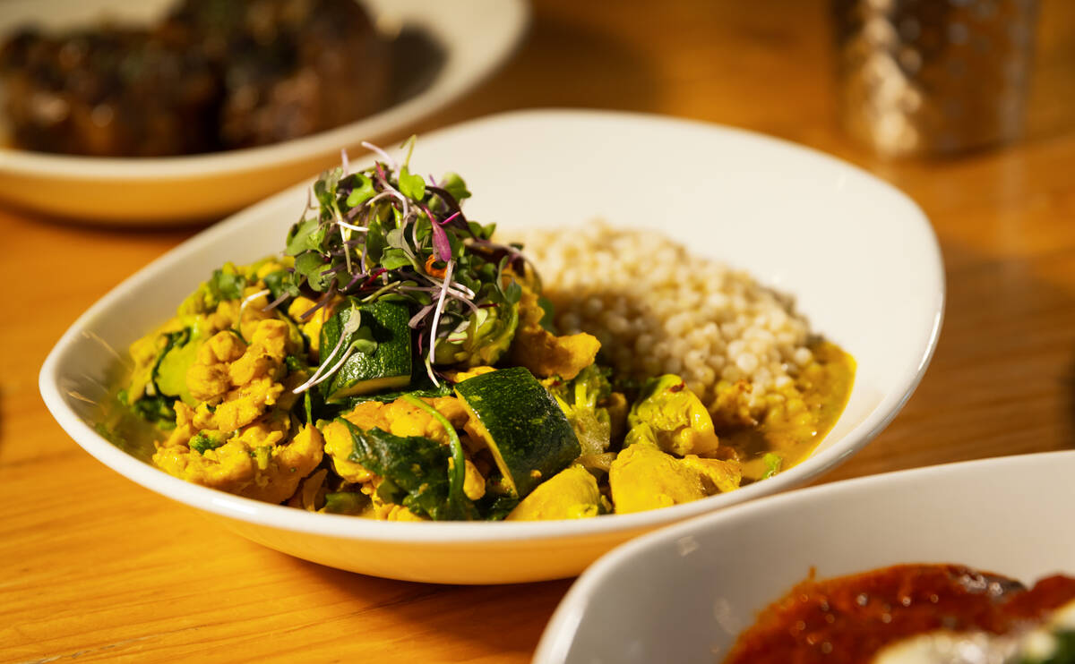 A Jamaican curry bowl is seen at DW Bistro at The Gramercy on Thursday, Dec. 5, 2024, in Las Ve ...