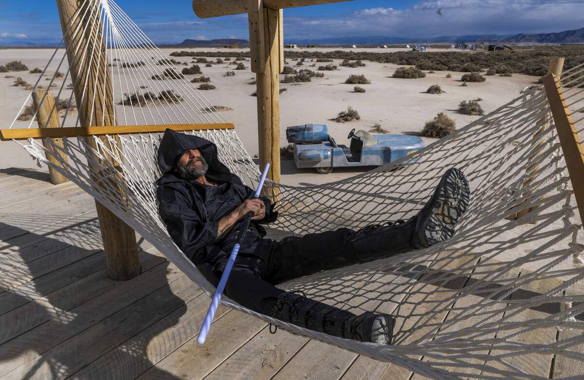 Robert P. Truex takes a rest on a hammock about the playa at Outpost X on Tuesday, Feb. 11, 202 ...