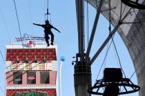 A person rides the Zip-Zilla zip line at SlotZilla at the Fremont Street Experience in downtown ...