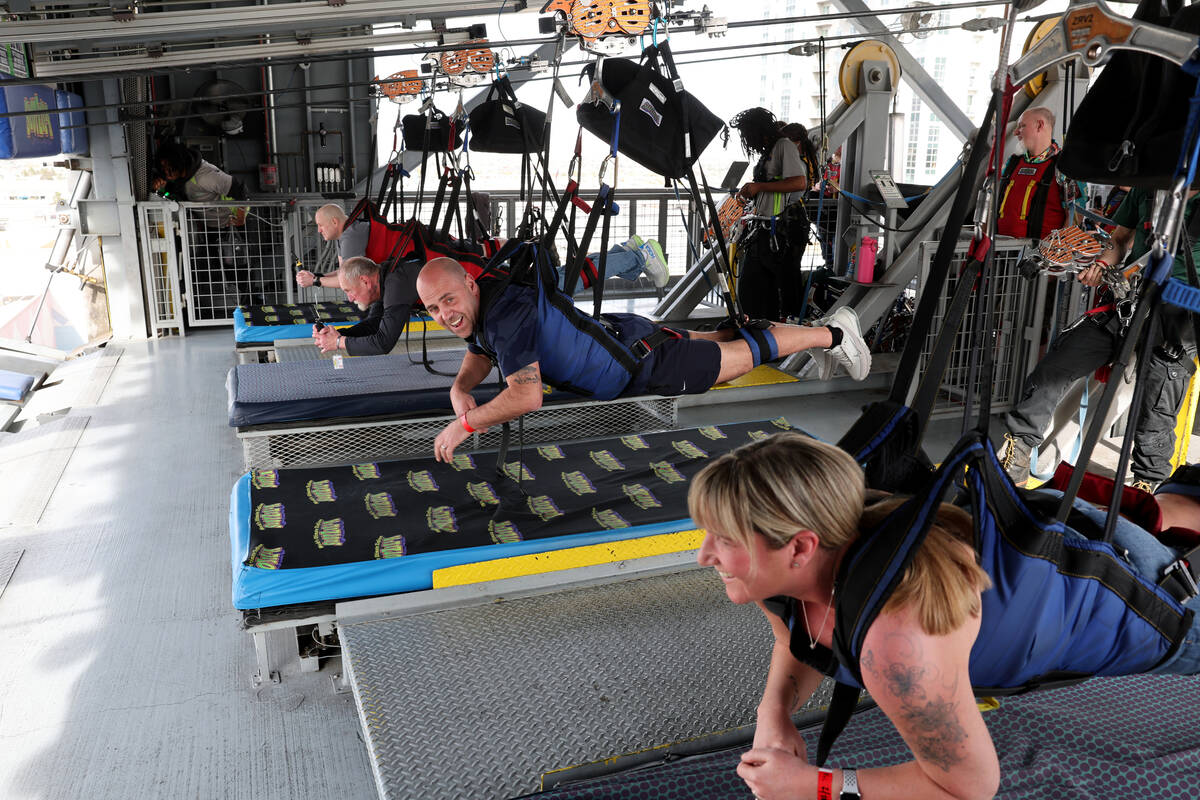 People prepare to ride the Super-Hero Zoom zoom line at SlotZilla at the Fremont Street Experie ...