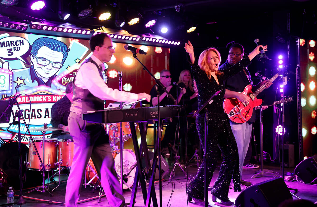 Kelly Clinton-Holmes entertains the crowd during the annual John Katsilometes birthday party fu ...