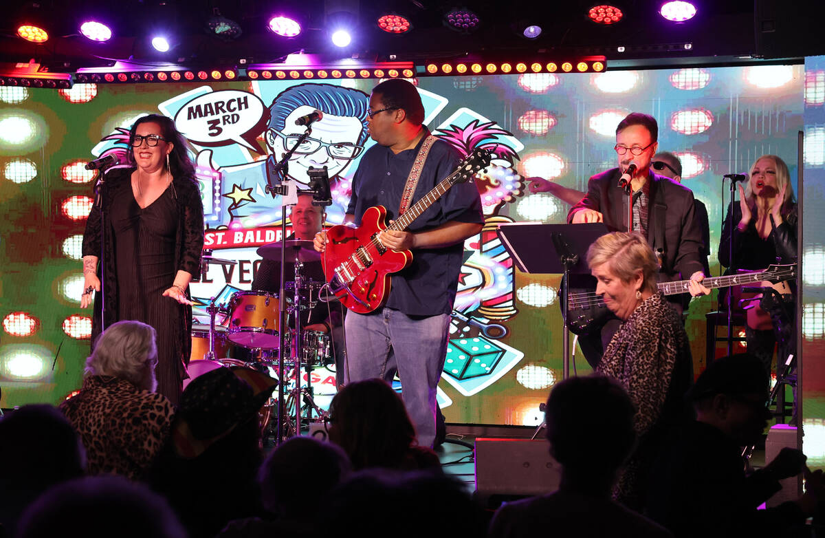 Stephanie Calvert, left, entertains the crowd during the annual John Katsilometes birthday part ...