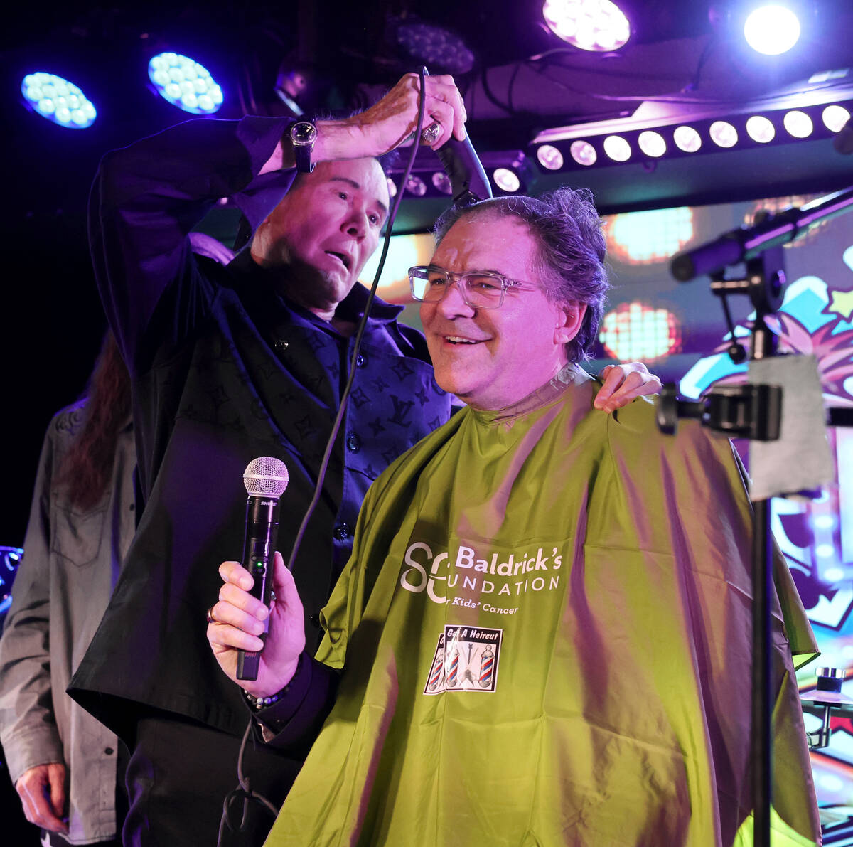 Las Vegas Review-Journal entertainment columnist John Katsilometes has his head shaved by Mr. L ...