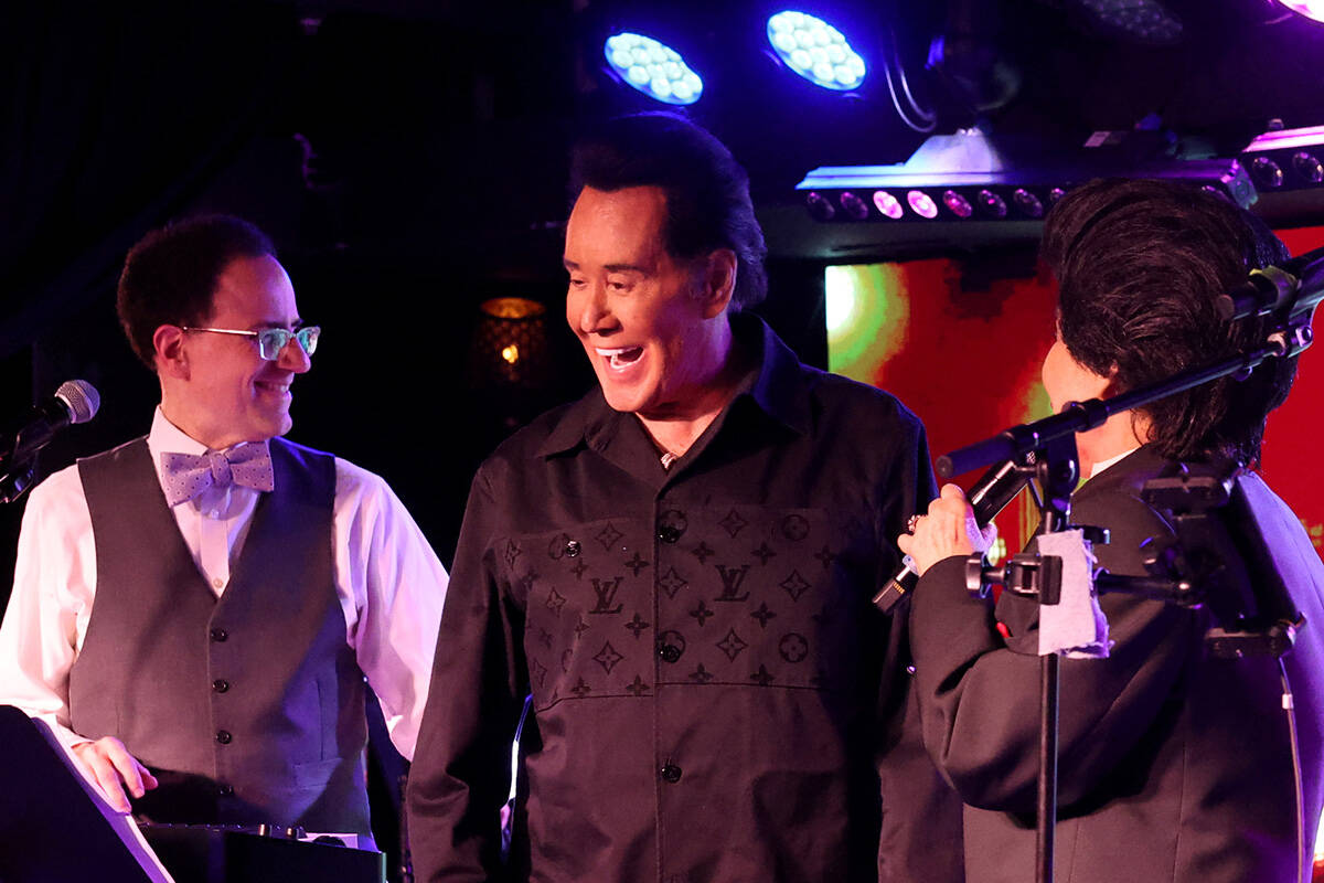Kelly Clinton-Holmes does a Wayne Newton impression as Mr. Las Vegas himself sneaks up on her d ...