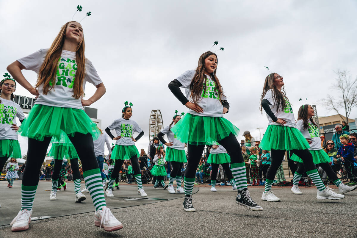 A dance group makes their way down the parade route during the St. Patrick’s Day parade ...