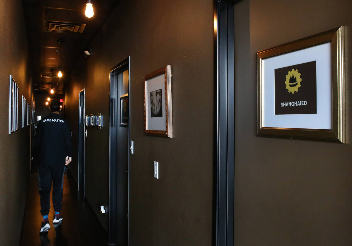 Private game rooms are seen at Escapology, where players are locked inside a themed room to pla ...