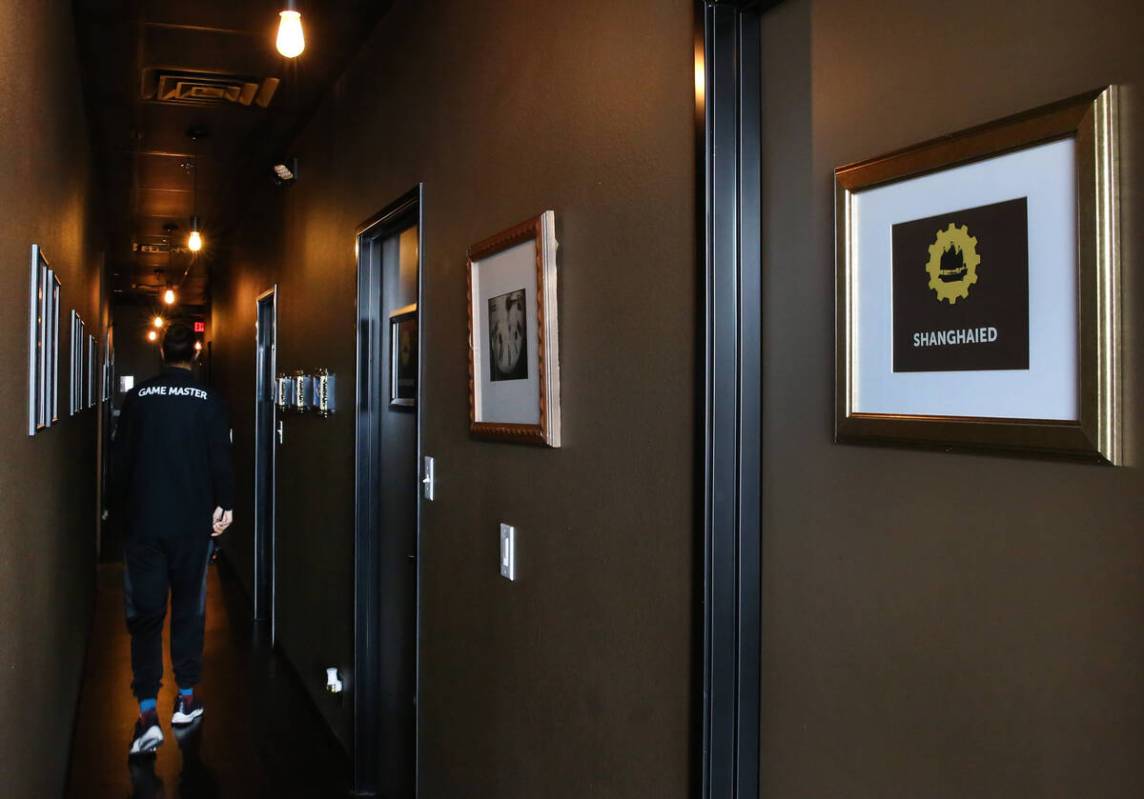 Private game rooms are seen at Escapology, where players are locked inside a themed room to pla ...