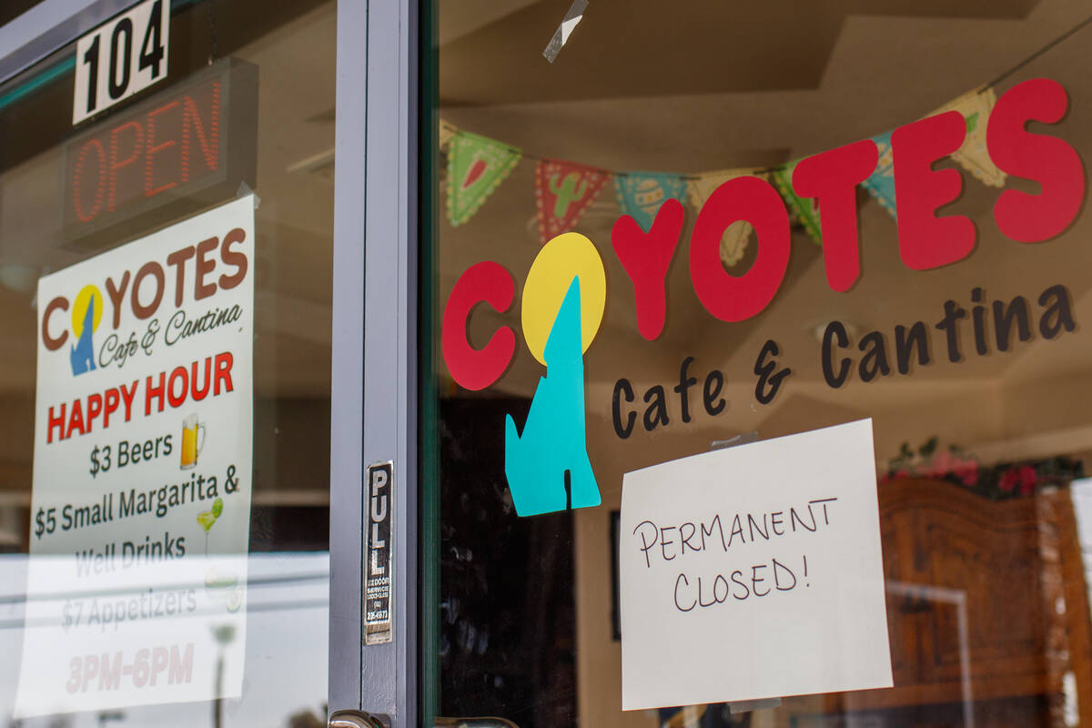 A sign on the doors of Coyotes Cafe & Cantina notes the restaurant’s permanent closure o ...