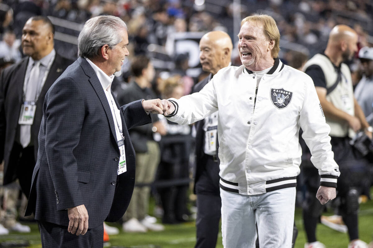 Raiders owner Mark Davis, right, greets attendees before the NFL game against the Atlanta Falco ...