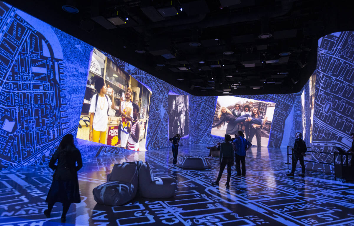 People take in a preview of “Rolling Stone Presents: Amplified, The Immersive Rock Exper ...