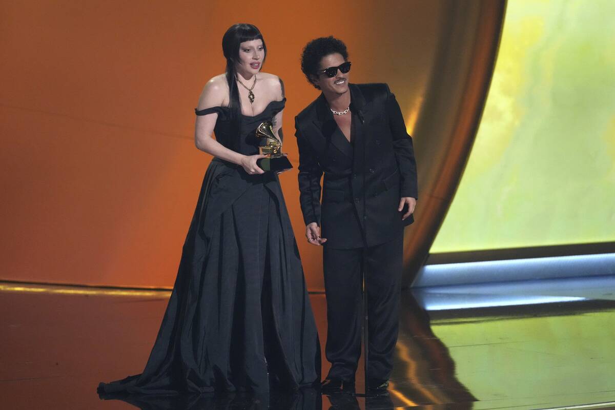 Lady Gaga, left, and Bruno Mars accept the award for best pop duo/group performance for "D ...