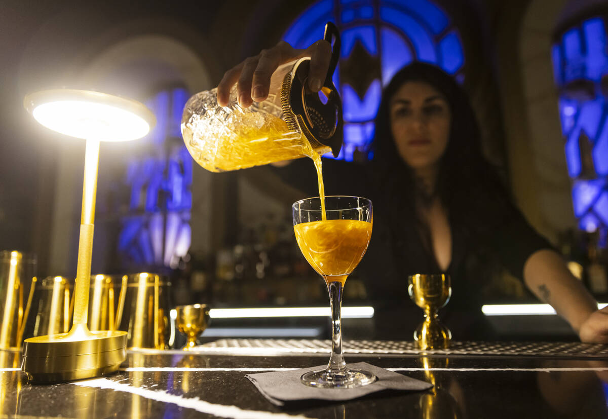 Brittagna Giordano prepares a glitter and gin cocktail at the John Wick Experience at Area15 on ...