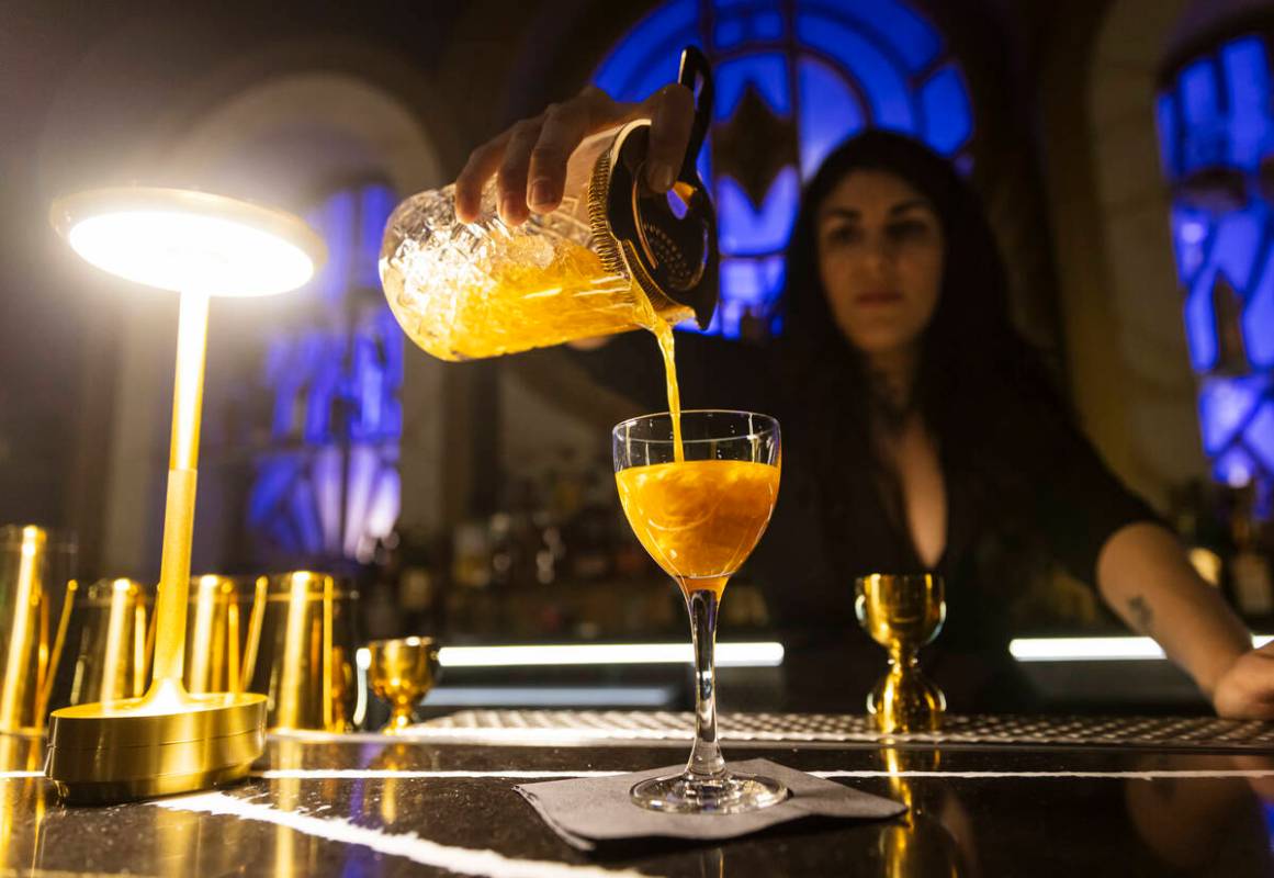Brittagna Giordano prepares a glitter and gin cocktail at the John Wick Experience at Area15 on ...