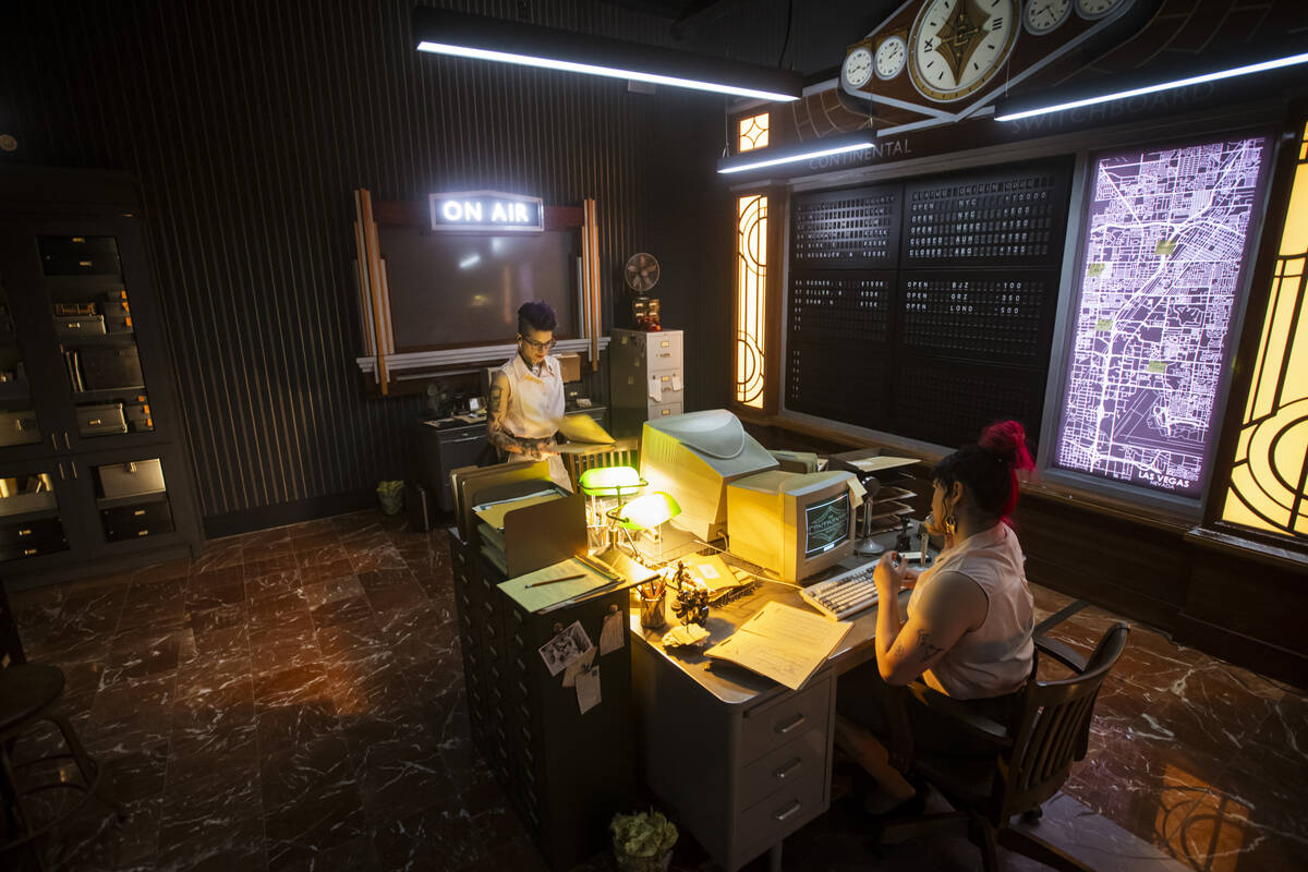 Tii Riga, left, and Karsyn Artemis Love, performers with the John Wick Experience, work in the ...