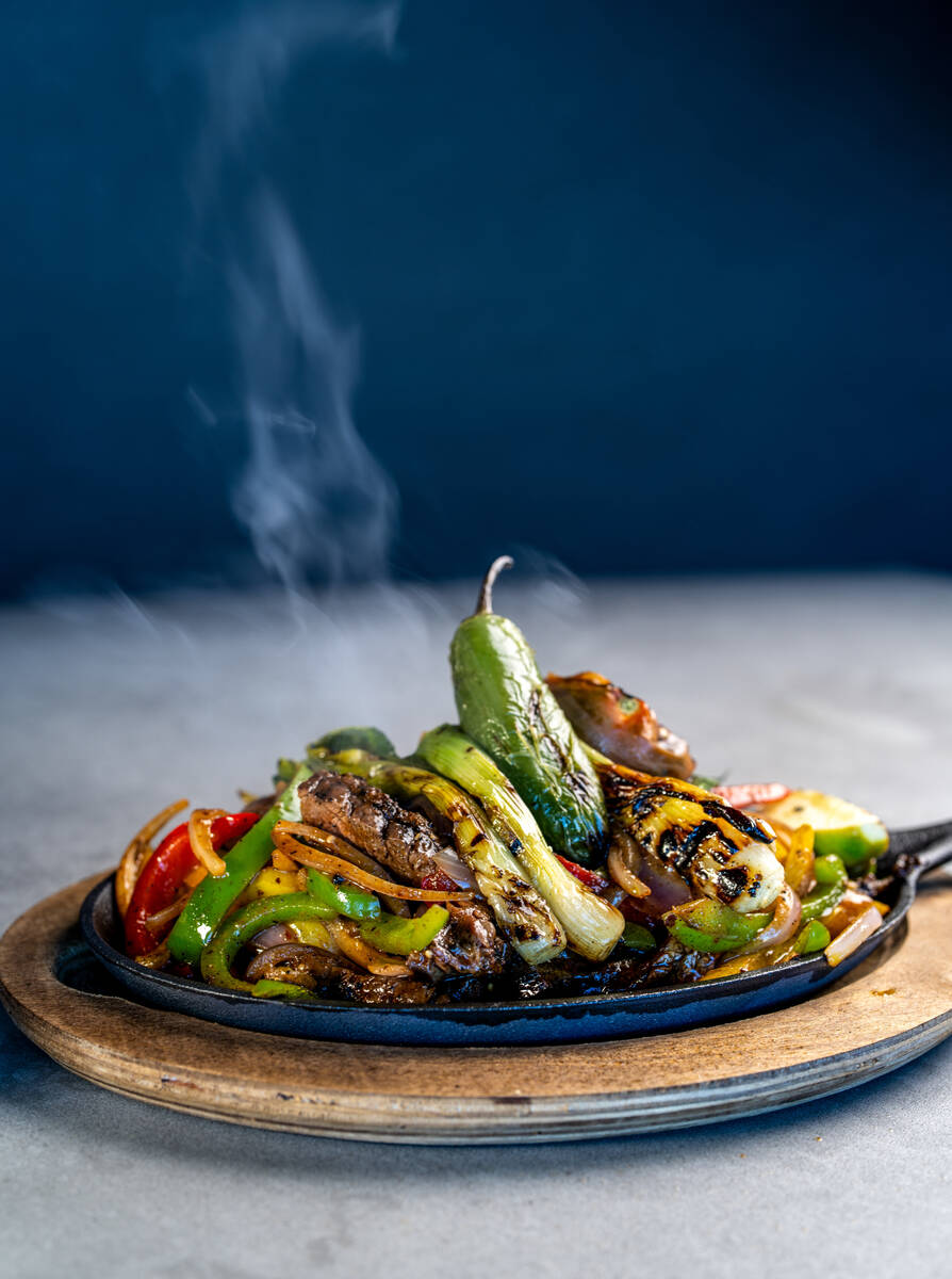 Sizzling fajitas from Patio, a poolside dining experience debuting April 4, 2025, at the M Reso ...
