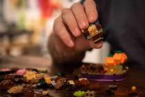 Steve Stephens works on a lego build at the Millenium Fandom Bar “Bricks n’ Booze ...