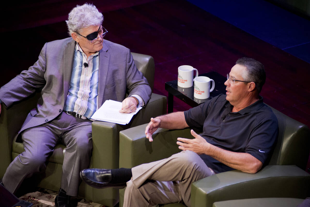 Norm Clarke, left, speaks with his guest, Hall of Fame pitcher Greg Maddux, during the Conversa ...