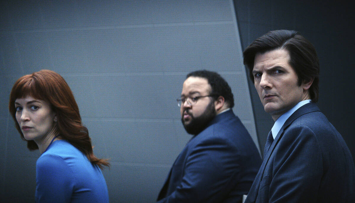 This image released by Apple TV+ shows Britt Lower, from left, Zach Cherry, Adam Scott in a sce ...