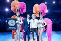 Rod Stewart is shown with Sean McBurney, regional president of Caesars Entertainment, and Vegas ...