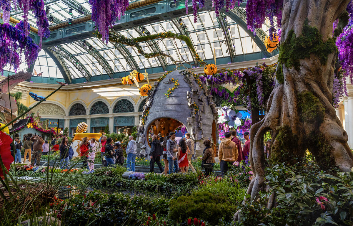 Visitors enjoy the “The Birds and the B’s” spring installation at the Bell ...
