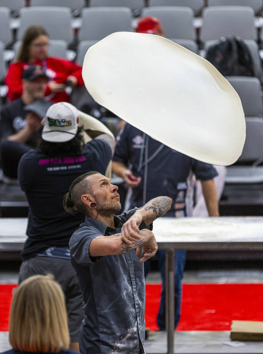 Competitor Curtis Rose with Sal & Mookies tosses his large pie dough during the Pizza Triat ...
