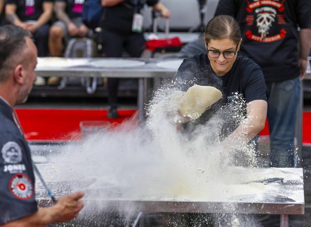 Competitor Tara Hattan with Andolini’s Pizzeria dives into her dough as flour flies every ...
