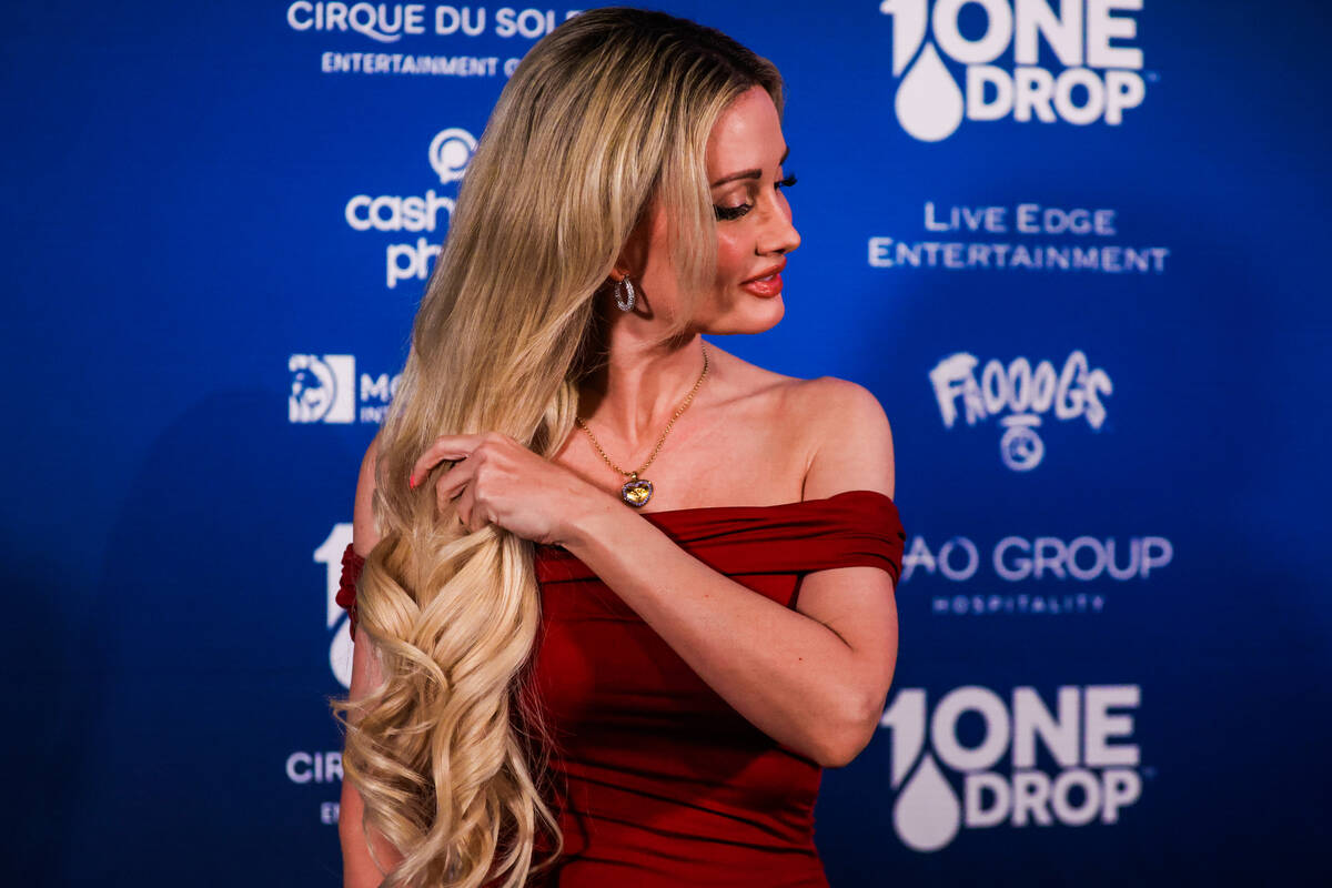 Holly Madison poses on the blue carpet at the One Night for One Drop event hosted by the One Dr ...