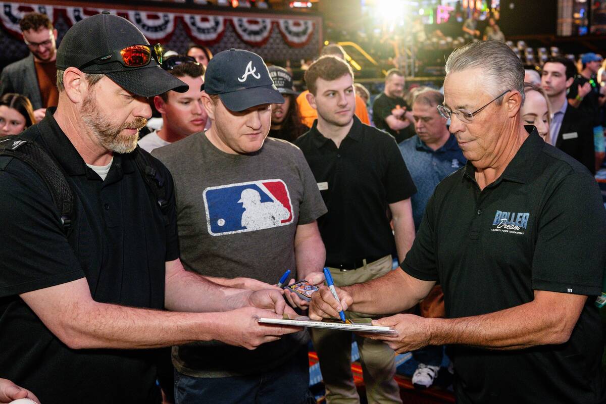 Former Major League great and Las Vegas native Greg Maddux signs autographs at the third annual ...