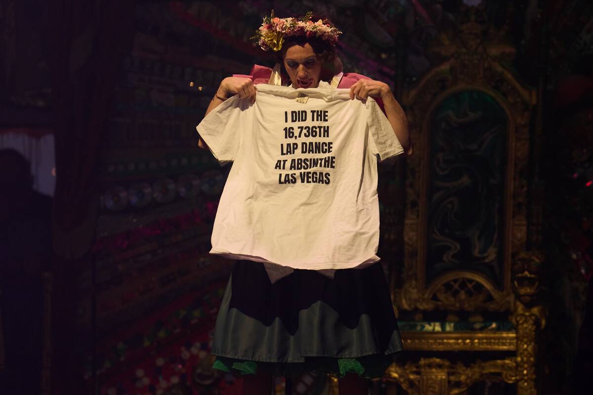 Sarah Lowe as Wanda Widdles shows off the prize for the 16,736th Lap Dance during Absinthe&#821 ...