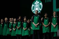 Starbucks baristas stand on stage, March 20, 2019, during an annual shareholders meeting in Sea ...