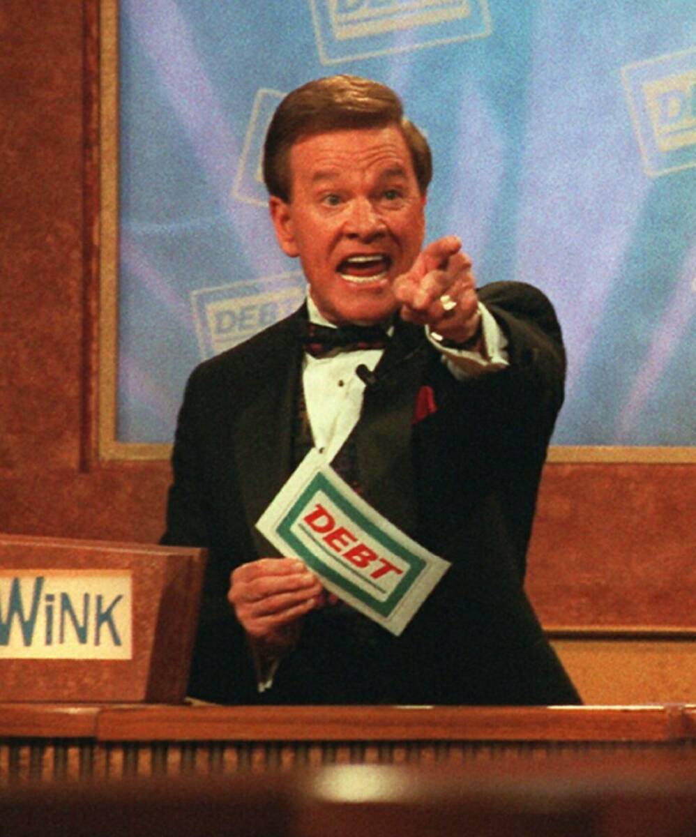 Host Wink Martindale indicates a correct answer to a contestant during the taping of the televi ...