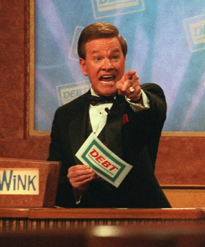 Host Wink Martindale indicates a correct answer to a contestant during the taping of the televi ...