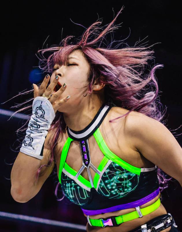 AZM, a professional Japanese wrestler, reacts to being hit during a Dragon Gate Rebirth match ...