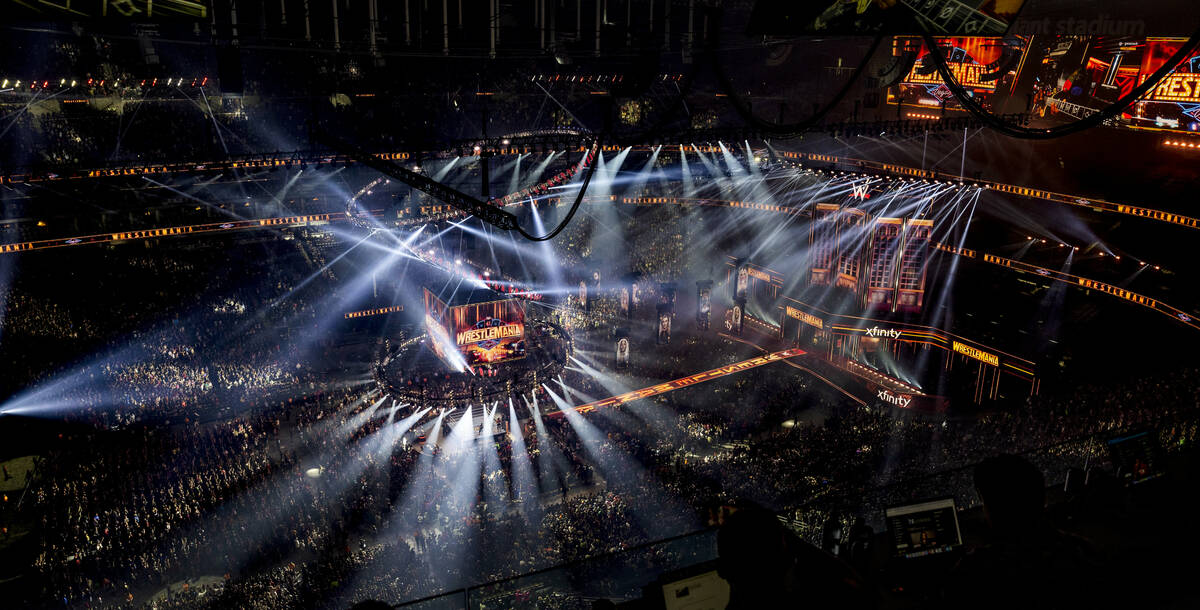 The crowd goes wild as the final fight is announced with the CM Punk versus Roman Reigns versus ...
