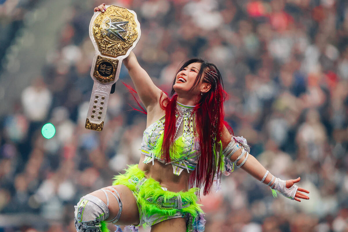 Iyo Sky celebrates her win during WWE WrestleMania 41 at Allegiant Stadium Sunday, April 20, 20 ...