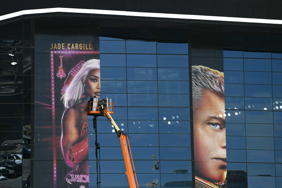 Building wraps for Wrestlemania are applied to the exterior of Allegiant Stadium Tuesday, April ...