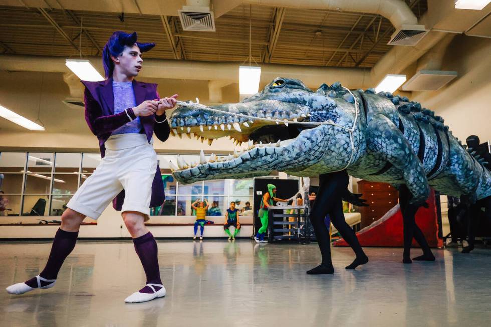 Young Captain Hook leads the alligator in during a dress rehearsal scene for “Peter Pan& ...