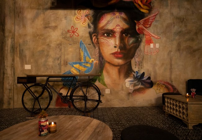 Artist Mallory Dawn painted this mural, which is seen in the speakeasy bar at Màs Por Favor Ta ...