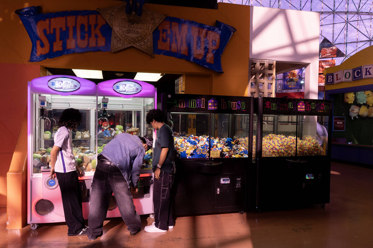 Teens play games to win plush animals in the Adventuredome at Circus Circus In Las Vegas. The h ...