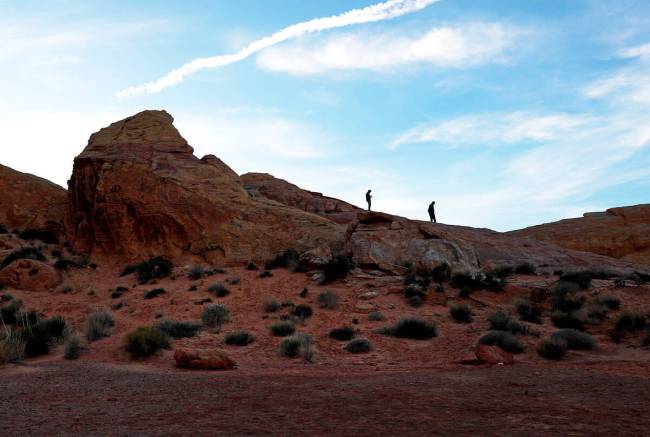People soak in the view at the Valley of Fire State Park. (Las Vegas Review-Journal)