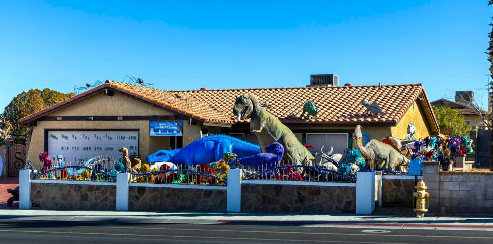 Numerous dinosaurs and other metal sculptures cover the front yard and even the roof at the Sha ...