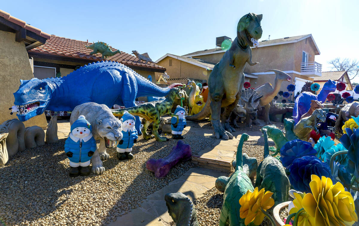 Numerous dinosaurs and other metal sculptures cover the front yard and even the roof at the Sha ...