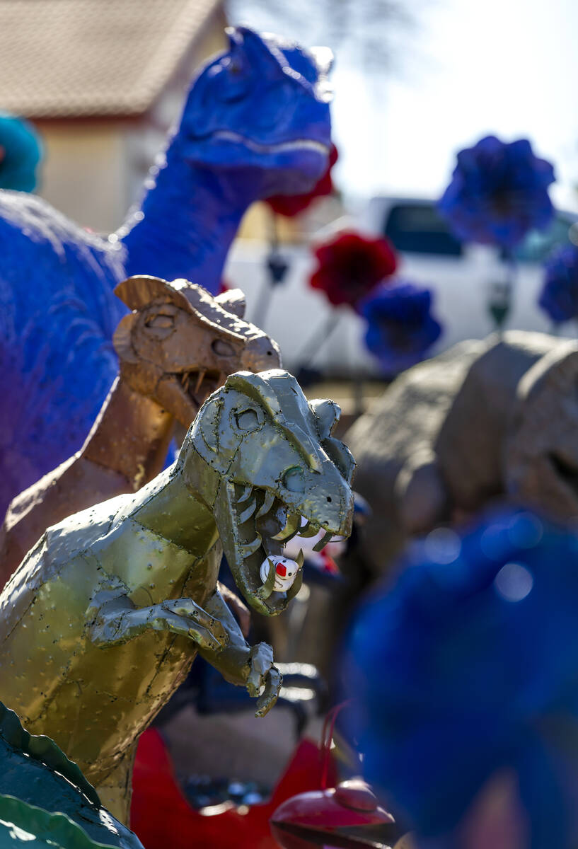 Numerous dinosaurs and other metal sculptures cover the front yard and even the roof at the Sha ...