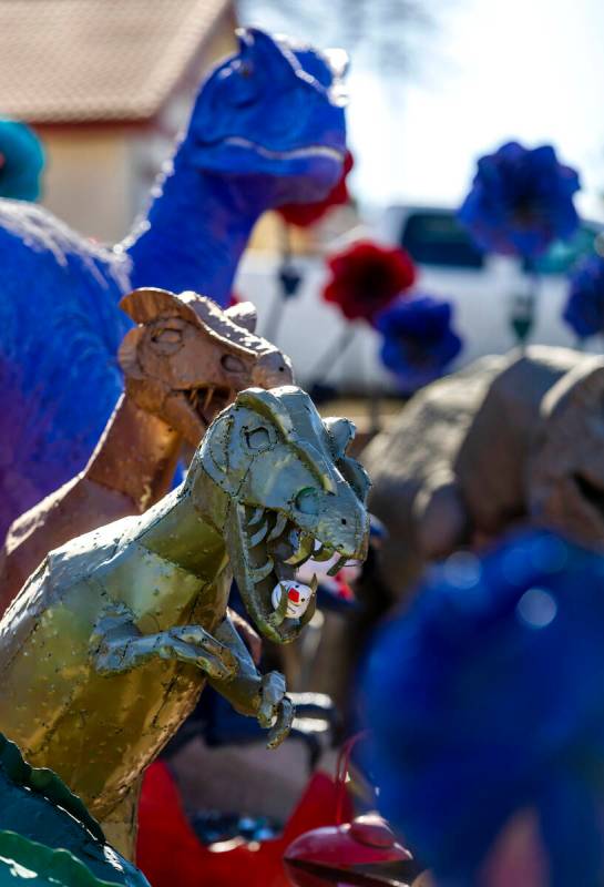 Numerous dinosaurs and other metal sculptures cover the front yard and even the roof at the Sha ...