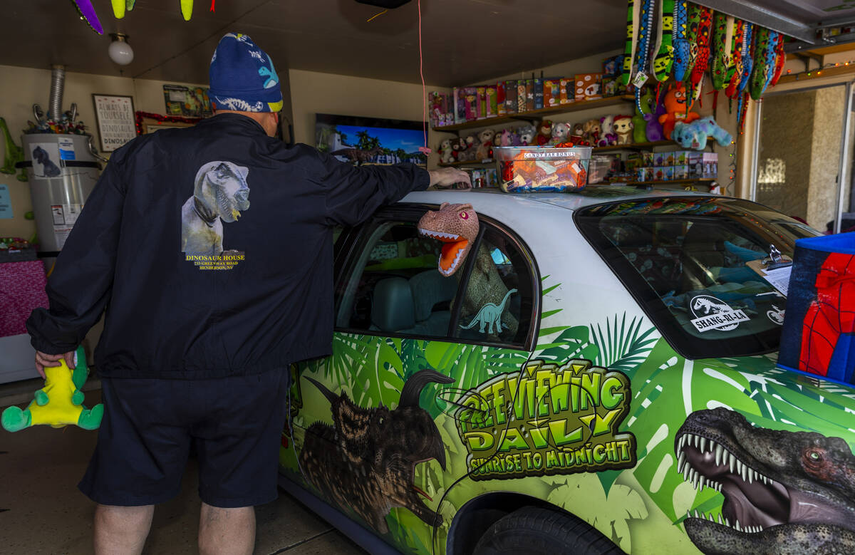 Former English teacher Steve Springer with his Dinomobile at the Shan-Gri-La Prehistoric Park a ...