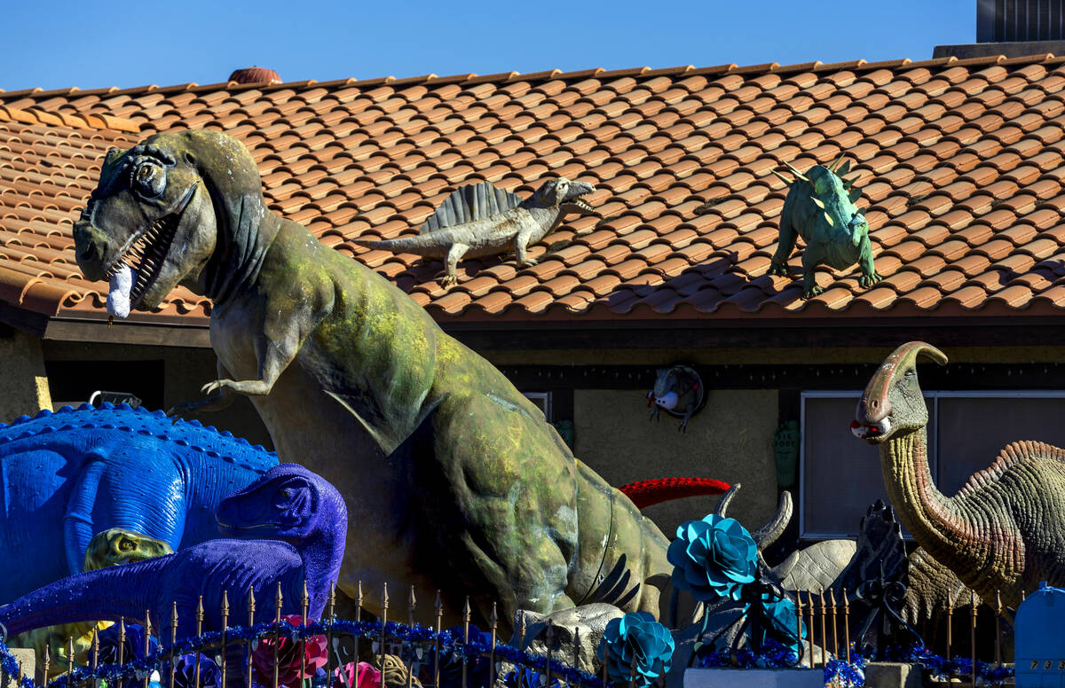 Numerous dinosaurs and other metal sculptures cover the front yard and even the roof at the Sha ...