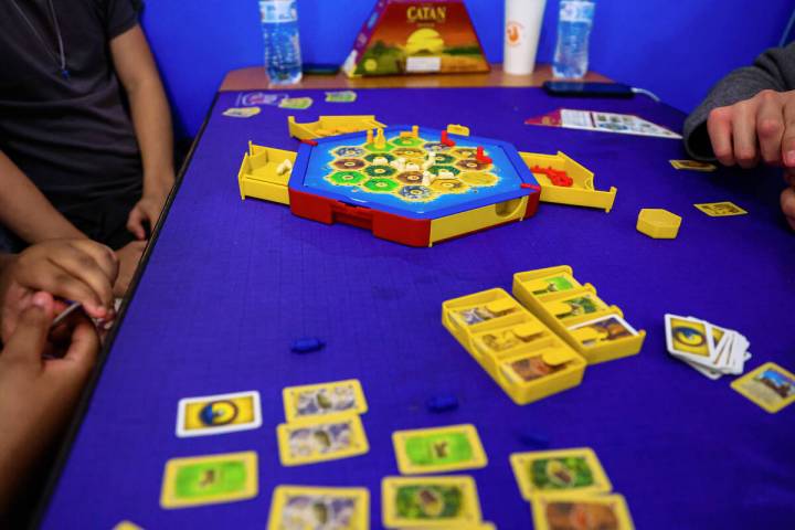 People play Settlers of Catan at Meeplevile Board Game Cafe on Thursday, March 20, 2025, in Las ...