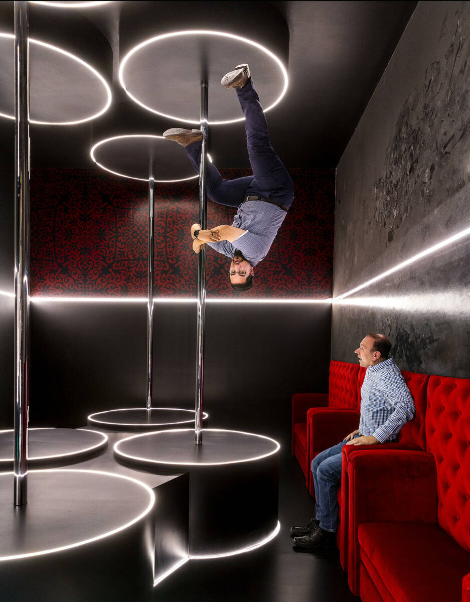 General manager Rob Wilson, top, appears to defy gravity with sales and marketing manager Billy ...