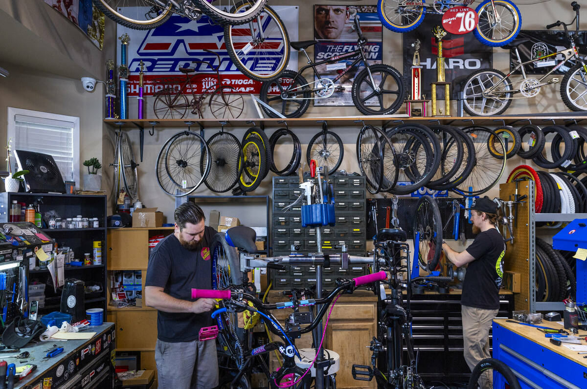 Mechanics Chris Bernardi and Teag Packard repair bicycles at the Vault Bicycle Shop which has a ...