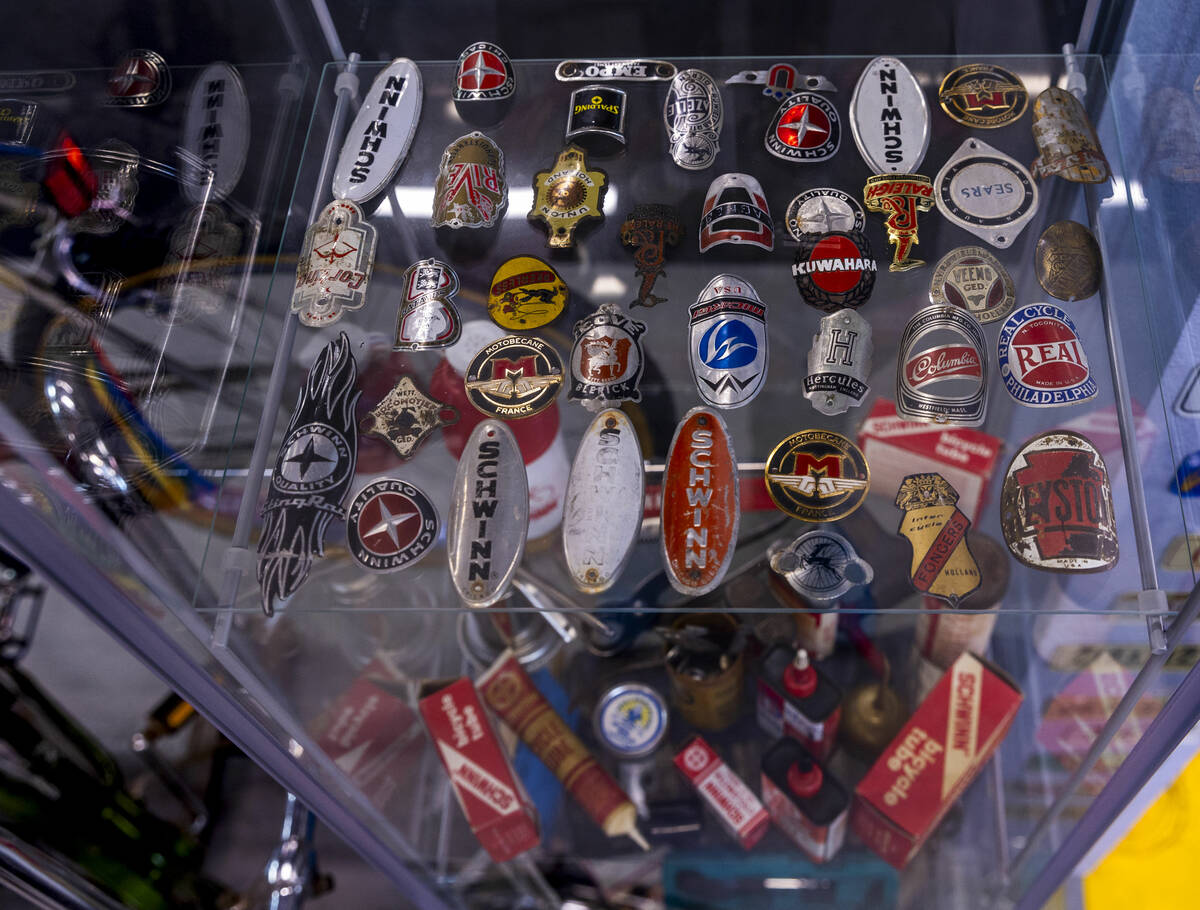 Vintage bicycle badges to be viewed at the Vault Bicycle Shop which has a “Walk down mem ...